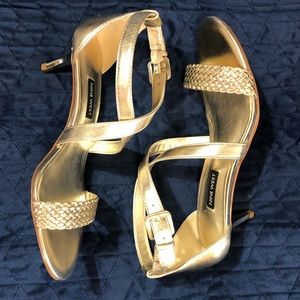 Gold colored size 8M Nine West sandals with heals